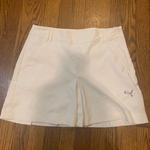 Look cute on the golf course with this Puma golf skirt with built in shorts.